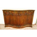 Regency-style mahogany serpentine sideboard, with a dentil frieze above a long cutlery drawer