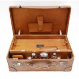 Pigskin dressing case with five silver-mounted glass bottles and other fittings, 1905, inscribed