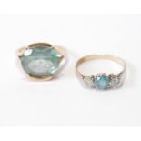 Diamond and blue zircon three-stone ring, probably 18ct, and another, blue spinel, 'K18', sizes O