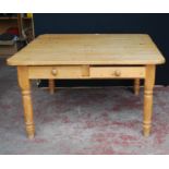 Pine farmhouse table of square form with canted corners with two cutlery drawers to each end, on