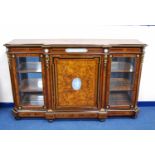 19th century French walnut ebonised and amboyna inlaid breakfront credenza, the panelled door