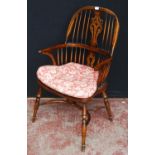 19th century ash and elm Windsor armchair, the hoop stick back with a pierced splat and dish seat,