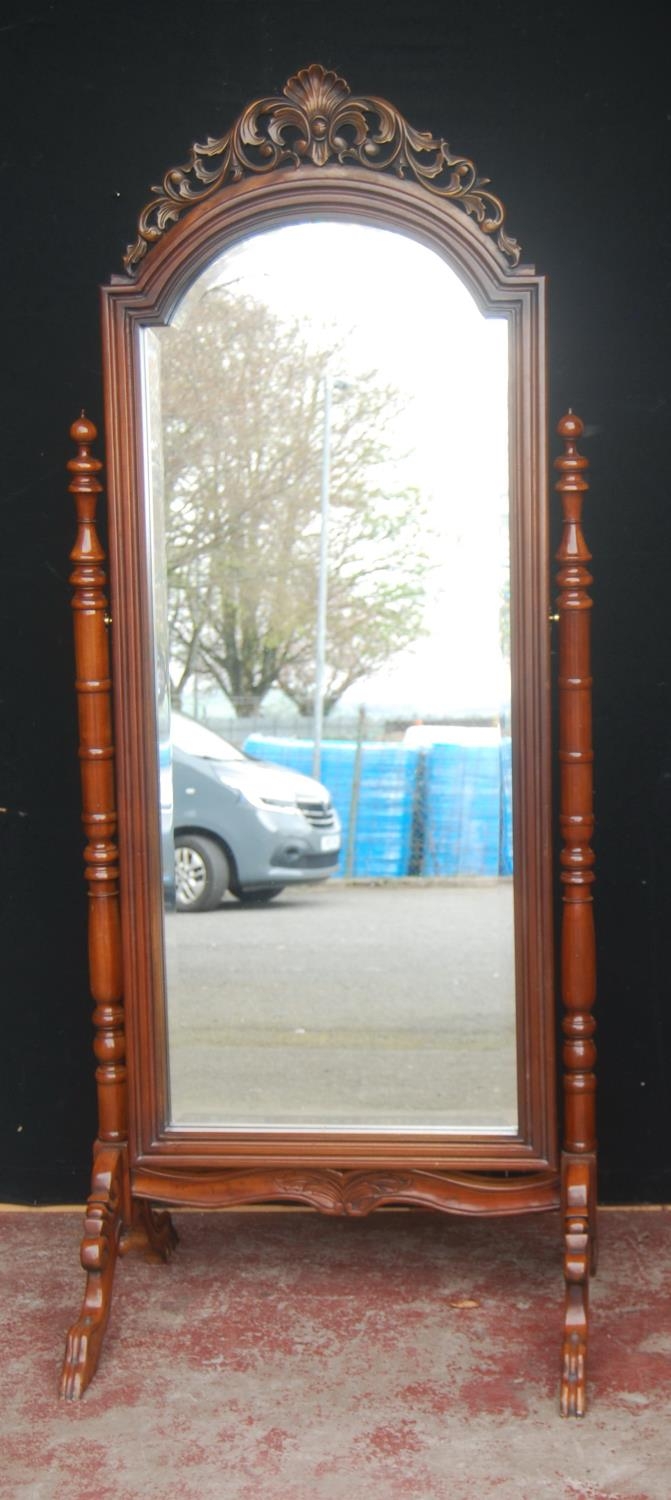 Victorian mahogany cheval mirror, the pierced scroll and fern pediment above an arched plate glass