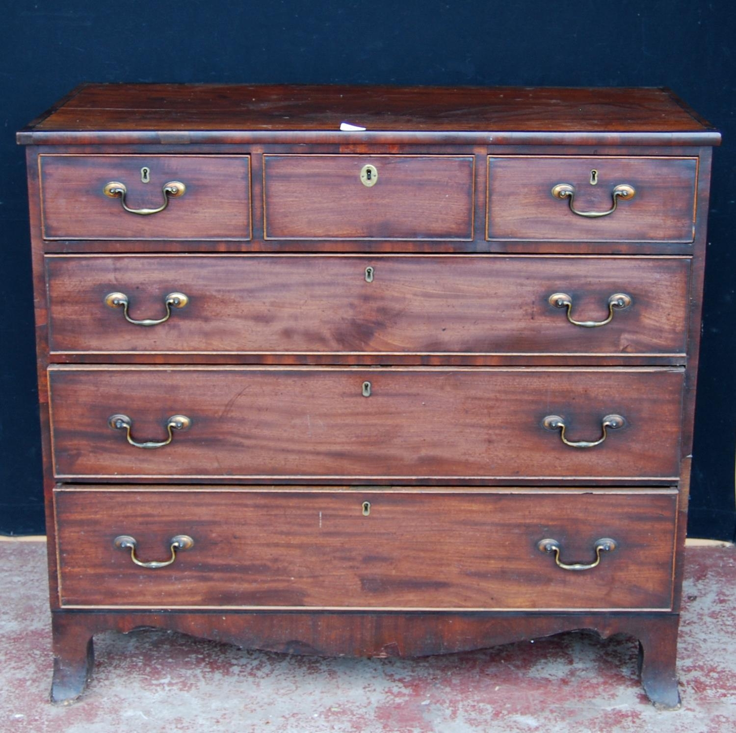 Georgian mahogany chest of three short and three long drawers, on bracket feet, with later brass