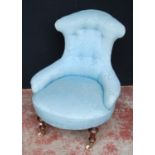 19th century mahogany lady's armchair, the shaped back rest upholstered in later blue button-back