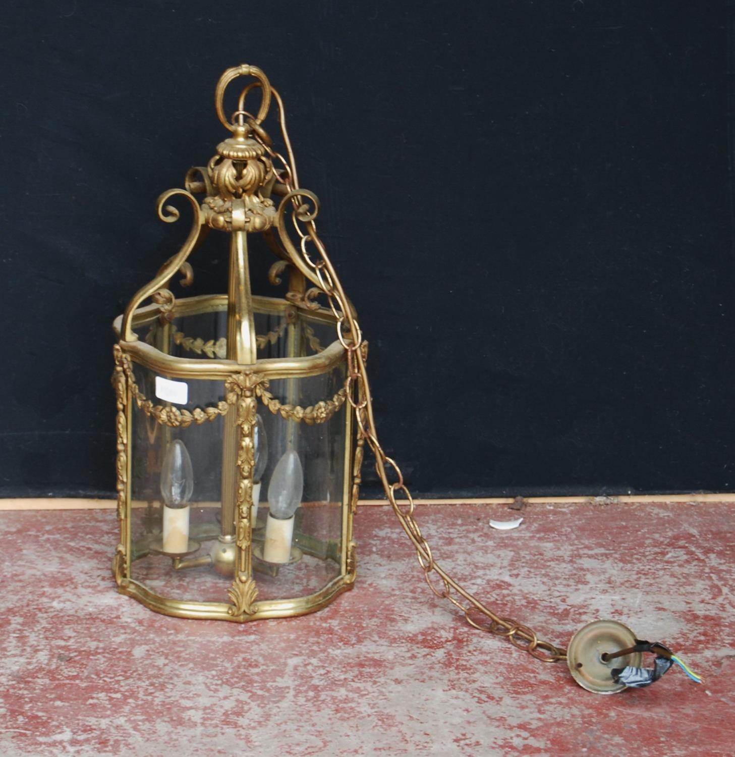 French-style gilt metal and glass lantern hall light, the cylindrical-shaped light decorated with