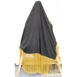 Silk shawl, in plain black silk with gold brocade-style tasselled fringe, approximately 110cm x