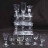 Collection of 18th century-style and similar antique drinking glasses to include liqueur glasses, on