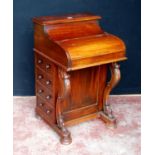 Victorian-style hardwood piano top davenport, the hinged top enclosing fitted drawers flanked by