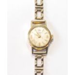 Lady's gold watch, '750', on 9ct gold bracelet, 7.7g without movement.
