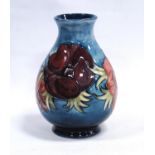 Moorcroft Anemones vase of baluster form, tube lined, glazed in blue, signed and stamped to the