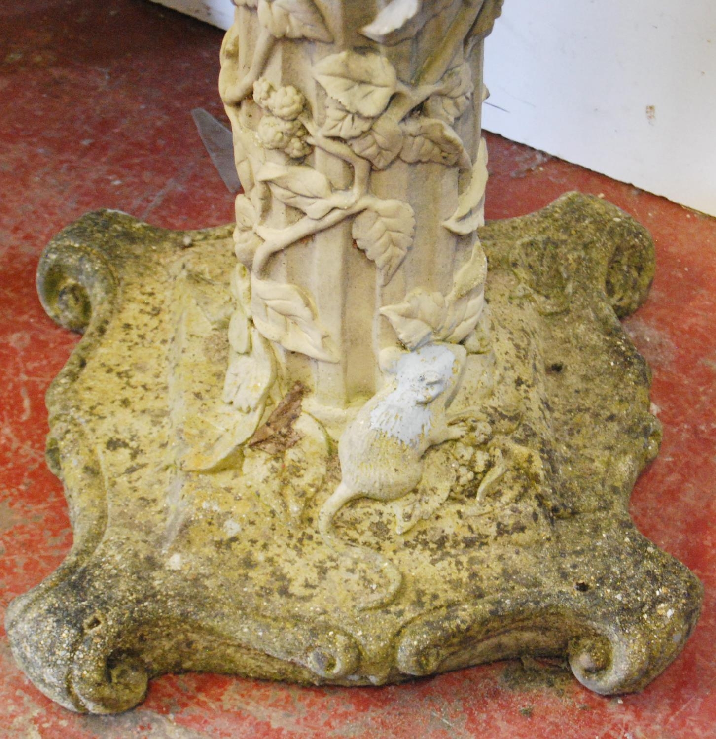 Stone garden bird bath decorated with a putti surmount to the open well, the cylindrical column with - Image 4 of 4