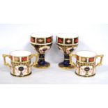 Pair of Royal Crown Derby Old Imari goblets, each on a circular foot, 12cm high, and a similar