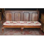 Early 19th century oak hall bench, with a four-section panelled back above a later slatted seat,