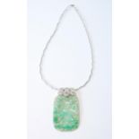 Jadeite pendant, rounded rectangular, with pierced and carved figure and sprays, upon diamond-set