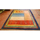 Gabbeh hand-knotted rug decorated with geometric medallions on a multi-coloured ground, 288cm x