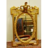 Reproduction gilt wall mirror in the Victorian manner with a floral cartouche surmount above