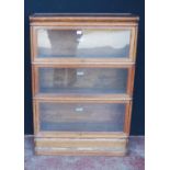 Globe Wernicke oak stacking bookcase, with three glazed sections, on base, with label to each