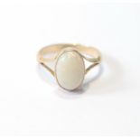 Opal ring, the cabochon 11mm x 7mm, in gold, '18ct', size M.