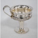 Silver heavy shallow cup, after the antique, with shallow double bowl, embossed with paterae, on