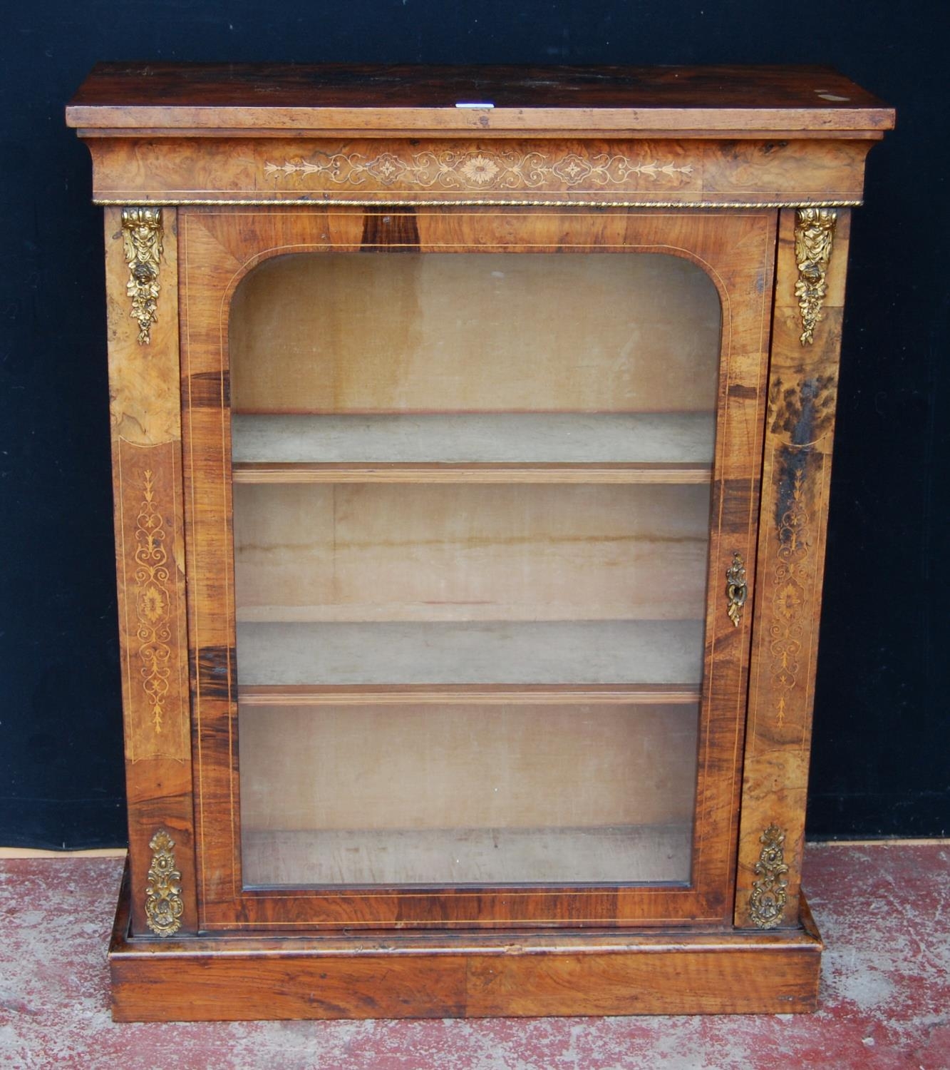 19th century French inlaid burr walnut pier cabinet, the inlaid frieze above a glazed door enclosing
