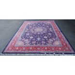 Persian Tabriz carpet with all over floral medallions on a central blue ground and a muted blue