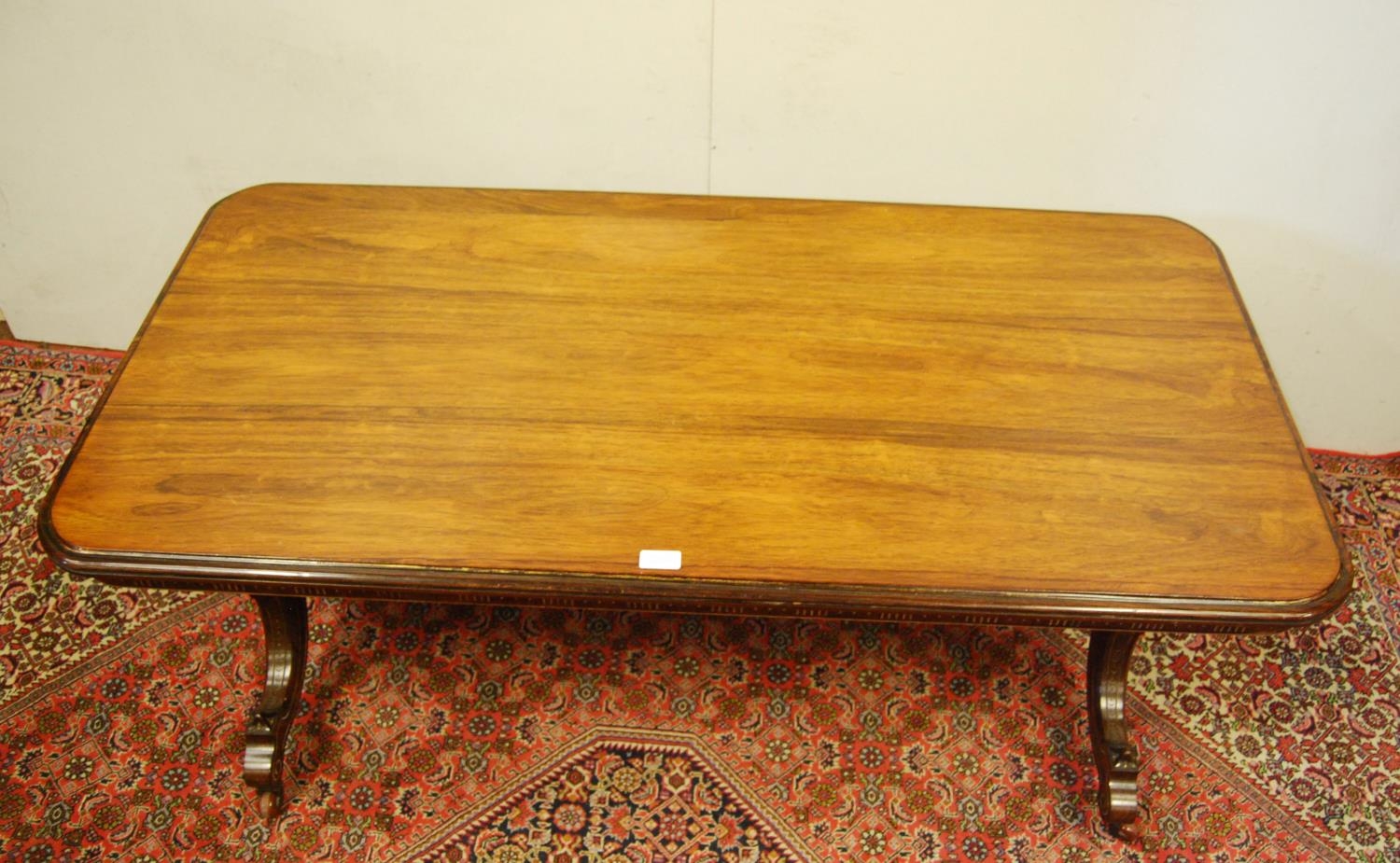 19th century rosewood and parcel gilt coffee table, the rectangular top with canted corners on three - Image 2 of 6