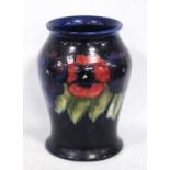 Moorcroft Pansy pattern vase, with tubed lined decoration, glazed in blue, stamped to the underside,