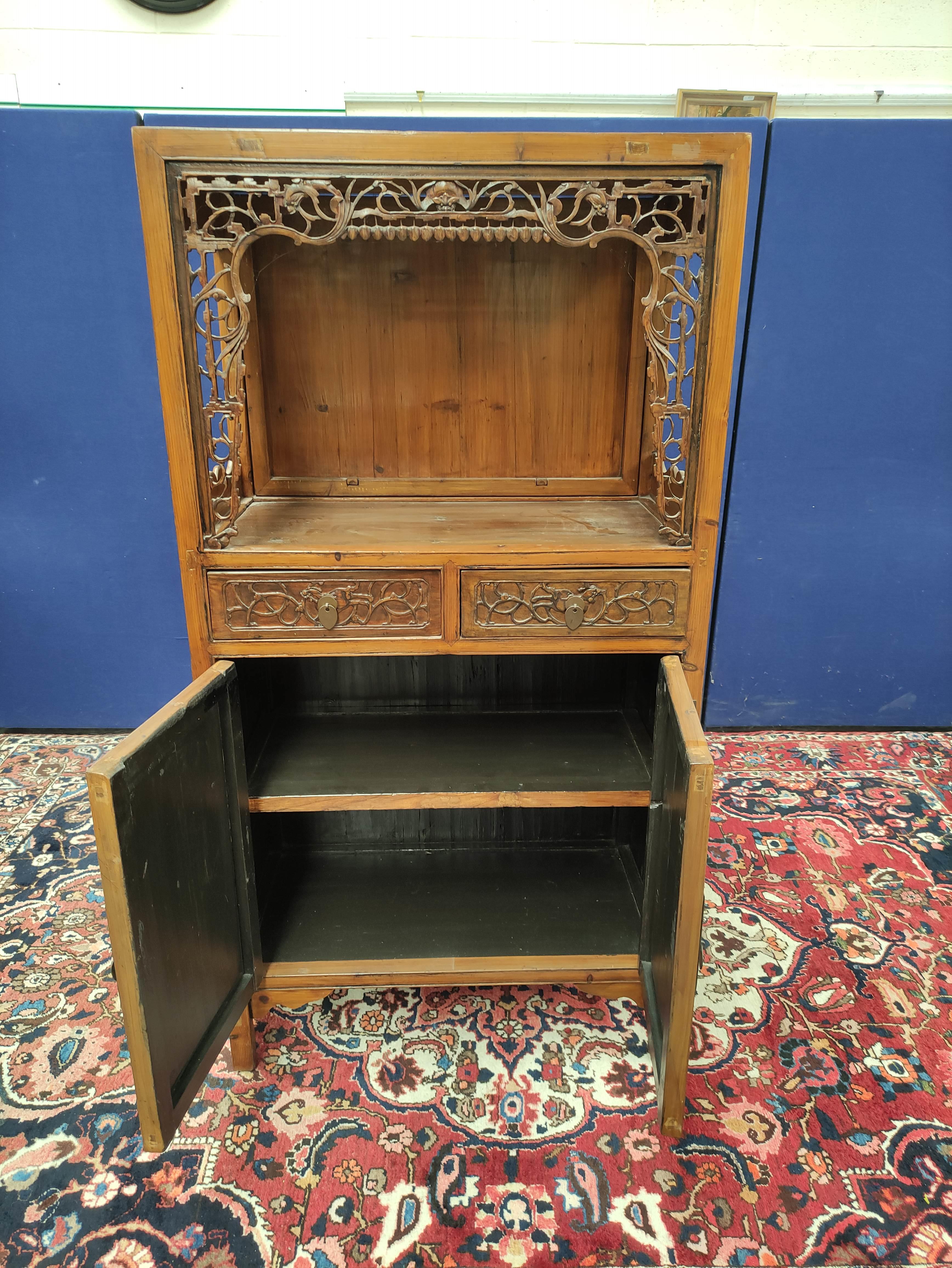 Chinese pine cupboard, with an open section to the top, decorated with Chinese fretwork, above two - Image 6 of 8