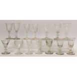 Fourteen various antique drinking glasses, the largest 12cm high.  (14).