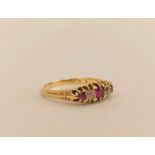 Edwardian ruby and diamond three stone ring in 18ct gold, size 'S'.