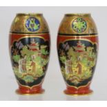 Matched pair of Carlton Ware vases of footed ovoid form decorated in polychrome and gilt, the