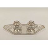 Silver inkstand, pierced with angled ends and two oval cut glass receivers by Huttons, 1906,