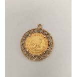 1/10 krugerrand, pierced gold detachable mount.