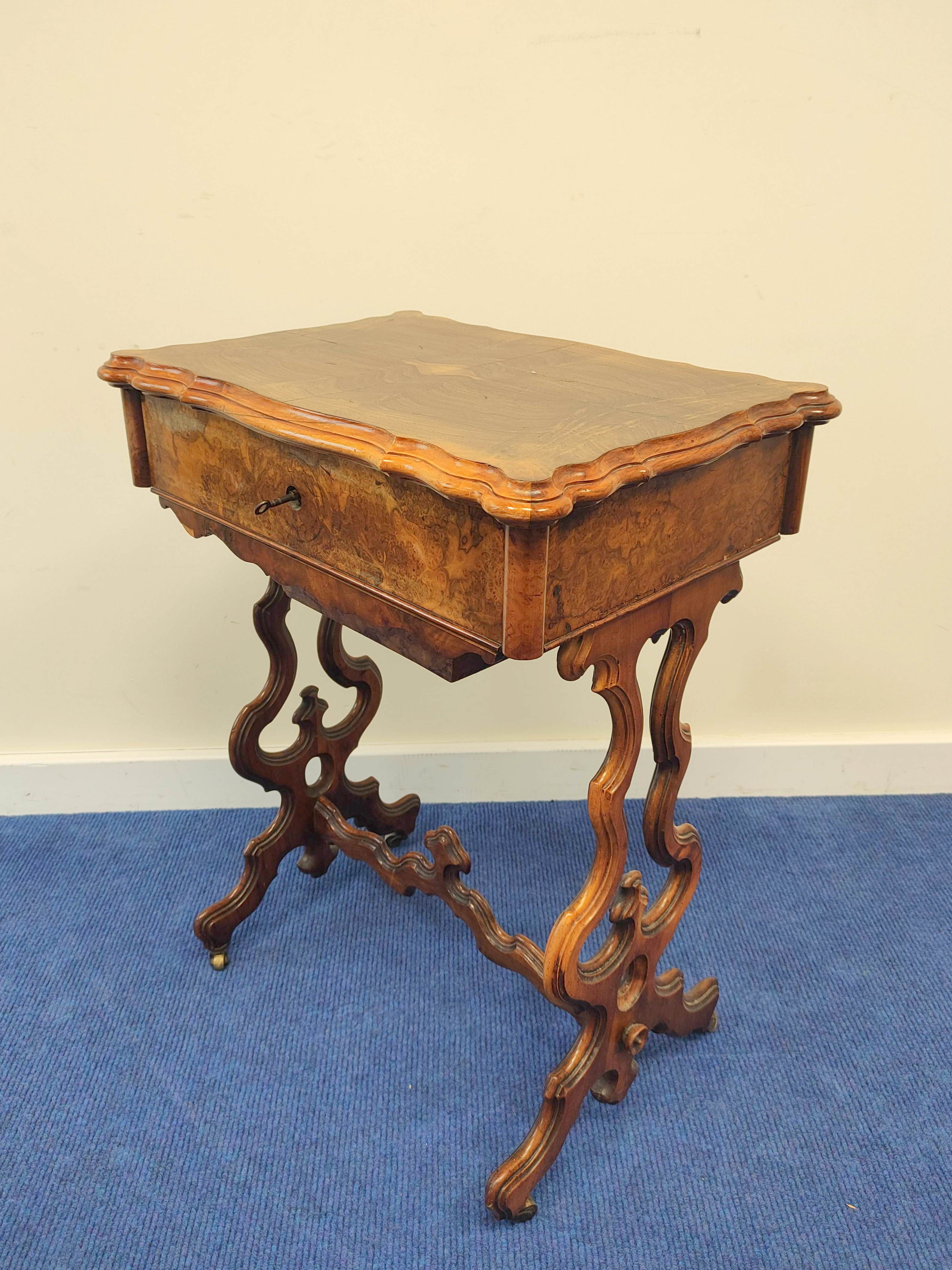 19th century burr walnut sewing table with hinged serpentine top enclosing a maple interior with a - Image 2 of 9