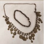 Oriental metal 'coin' chain necklace or belt, 110cm long, and a short Chinese necklace of carved