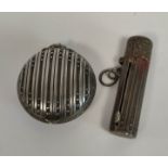 French silver compact of flattened globular shape, with embossed beads and the matching lipstick