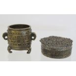 Chinese miniature barrel shaped vessel or censer with twin elephant mask handles and tripod feet,