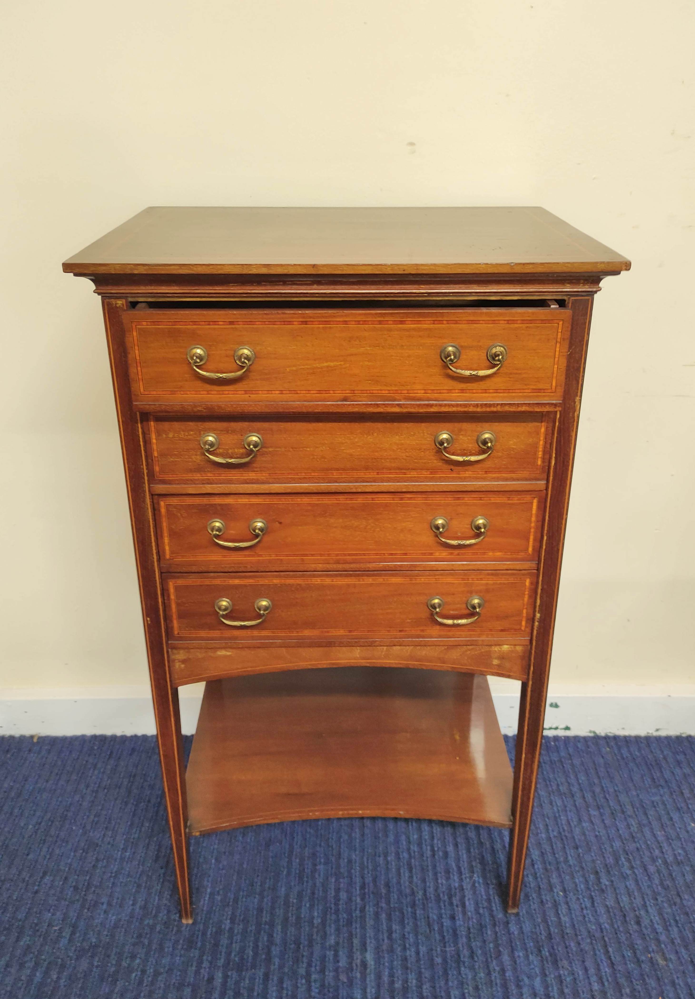 Edwardian inlaid mahogany music cabinet with four fall front drawers above undertier. Decorated