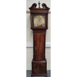 Eight day long case clock by Waddington 'de Chorley' the 12¾" brass dial with matted centre date