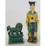 Chinese Shiwan pottery figure of a Daoist sage, standing with hands clasping a tablet, 20.5cm