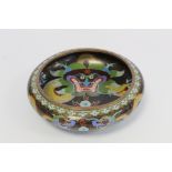 Chinese cloisonné circular bowl, the black ground with polychrome enamel, large scrolling dragon and