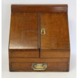 Late 19th/early 20th century oak stationery/writing box of rectangular form, the sloping front