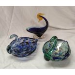 Two mottled art glass dishes in the form of swans, each 21cm long and another similar bird dish,