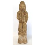 Chinese Northern Wei terracotta standing figure of a warrior with traces of red pigment, 42cm high.