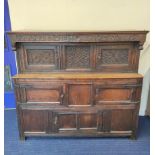 James II oak court cupboard. The carved scroll frieze, initialled P & M and dated 1687, flanked with
