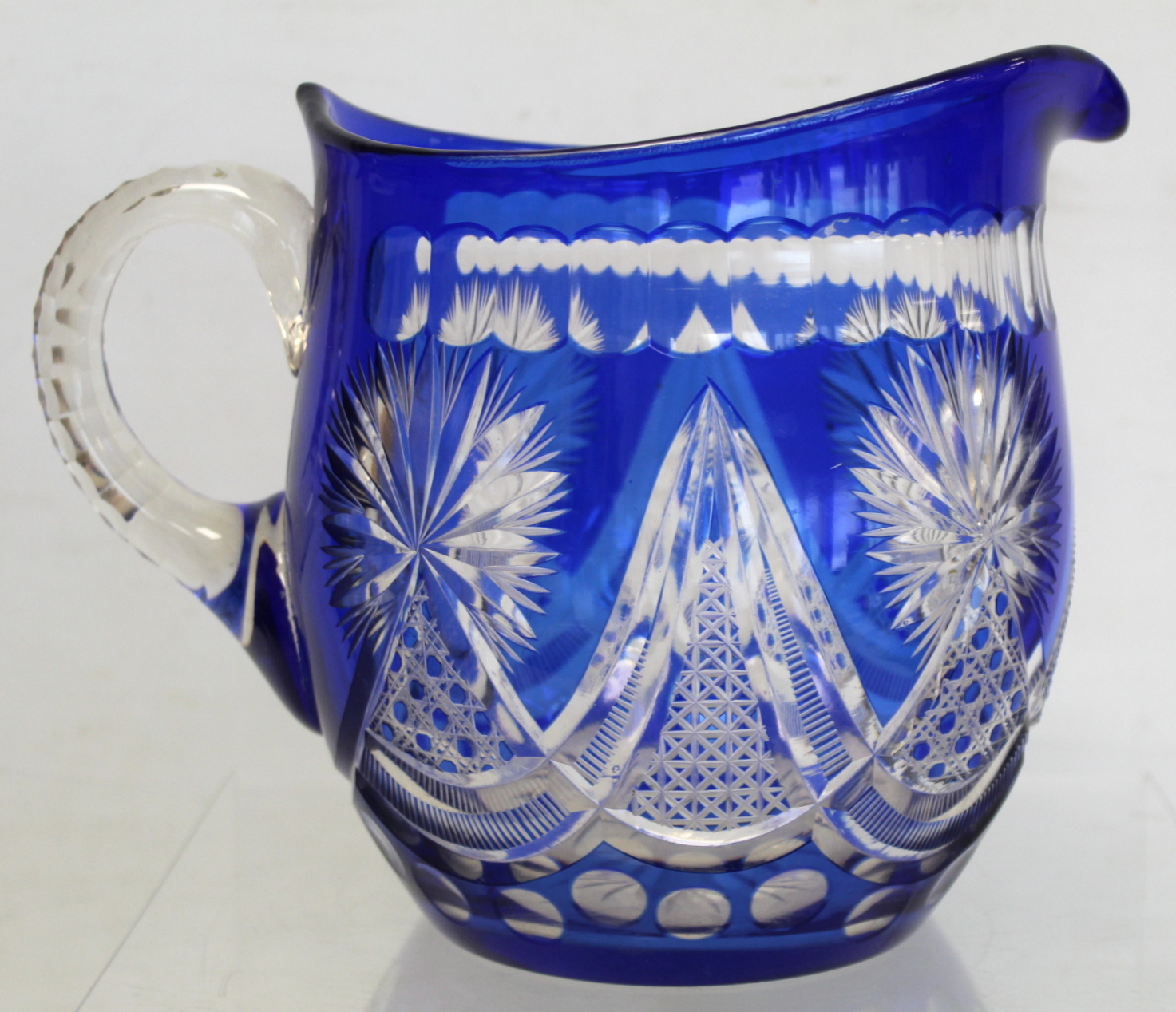 Bohemian blue flashed cut glass water jug of helmet form, 19.5cm high; a pearlescent clear glass - Image 4 of 10