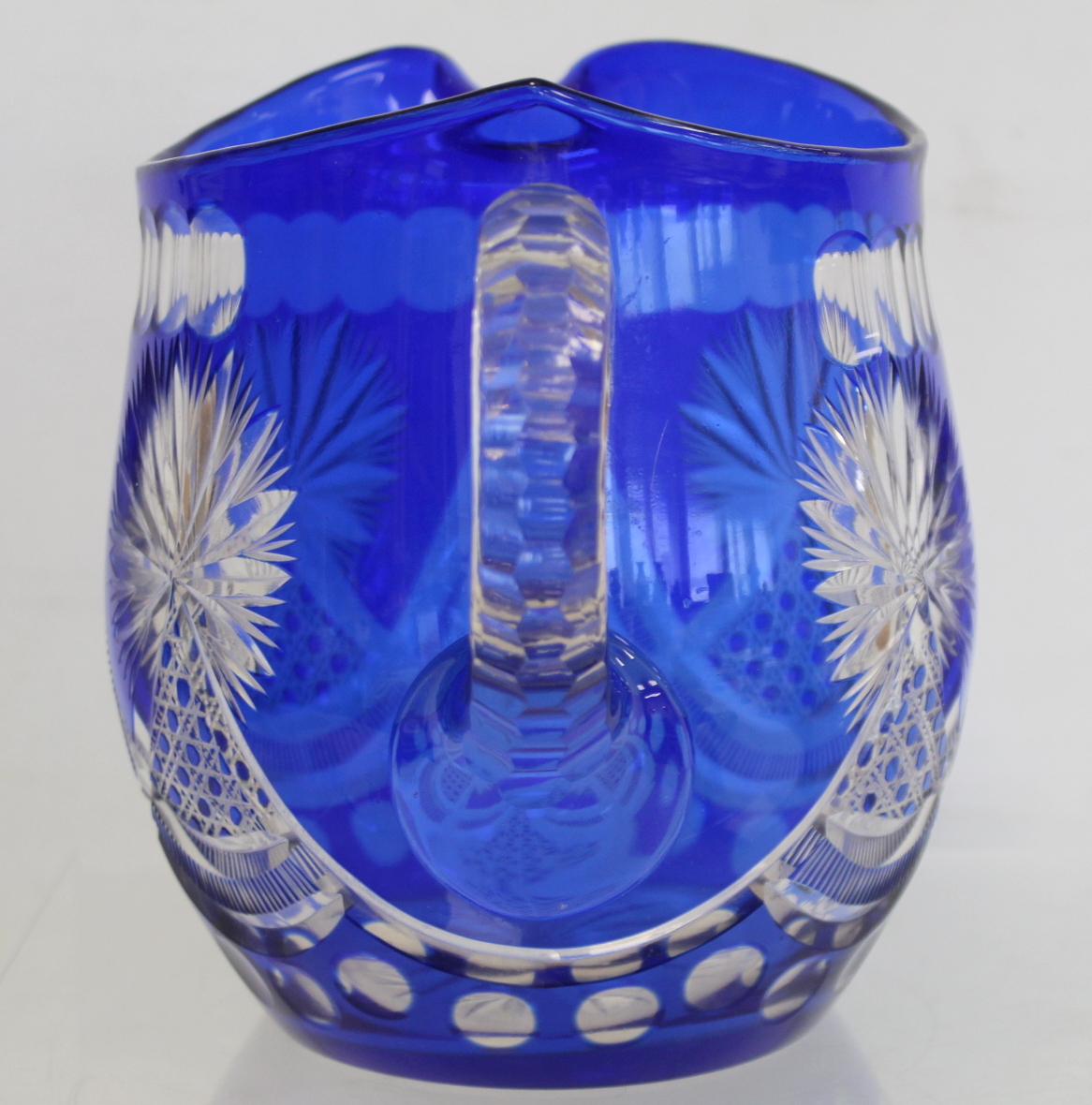 Bohemian blue flashed cut glass water jug of helmet form, 19.5cm high; a pearlescent clear glass - Image 5 of 10