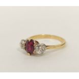Diamond and ruby three stone ring with with oval ruby, approx. 6mm x 5mm and two old cut