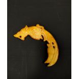 Chinese curved mottled yellow jade carving of a mythical Pixiu, 11cm long.